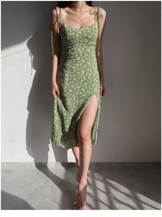Model sporting the dress in green