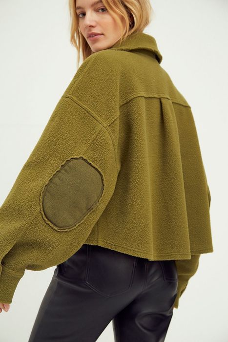 Same model showcasing the elbow patches on the jacket.