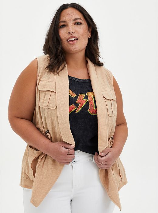 Model wearing a taupe-colored vest.