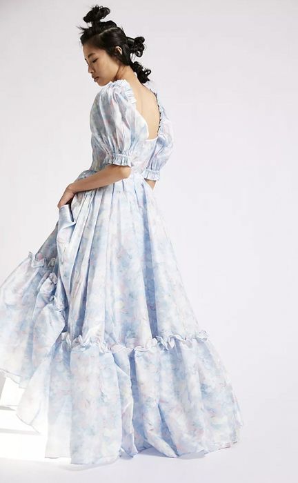 Model showing the back of the maxi dress.