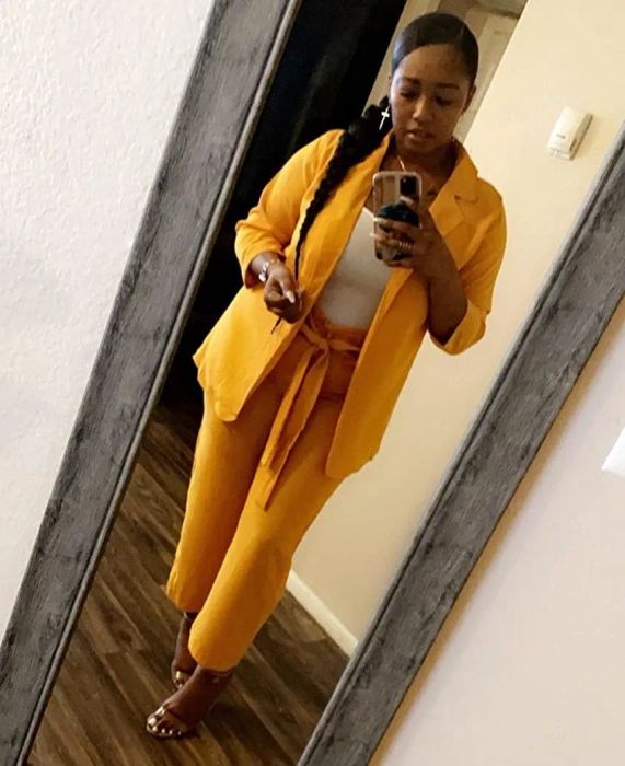 Reviewer wearing the gold set with a white top