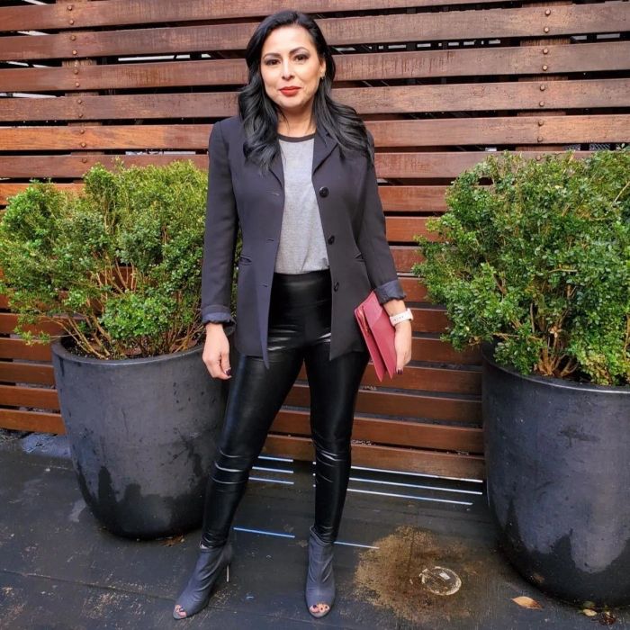 Reviewer is donning a pair of sleek faux leather leggings.