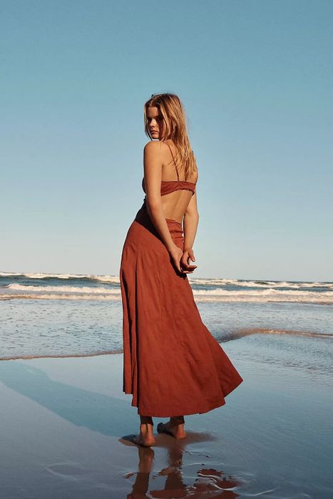 Back view of the dress in a vibrant orange hue.