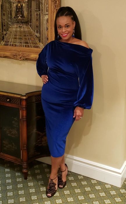The dress in a striking blue hue.