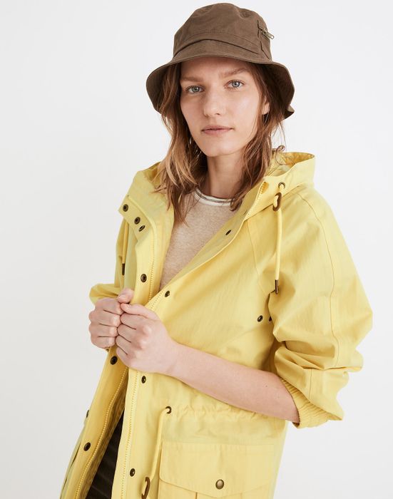 Another model wearing the yellow raincoat.