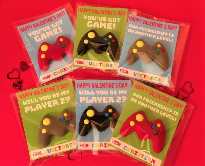 Six video game controller erasers, each paired with a card.