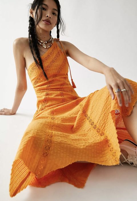 The dress in a vibrant orange color.