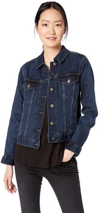 model rocking a dark blue denim jacket