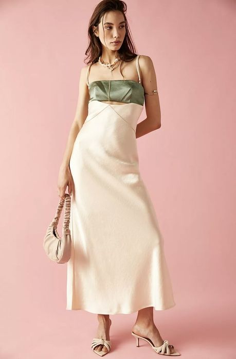 The dress comes in green and off-white.