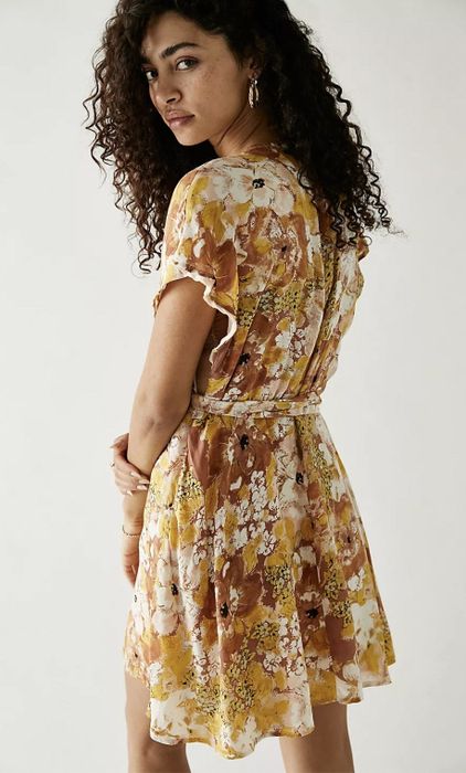 Back view of the dress, showing its design from behind.