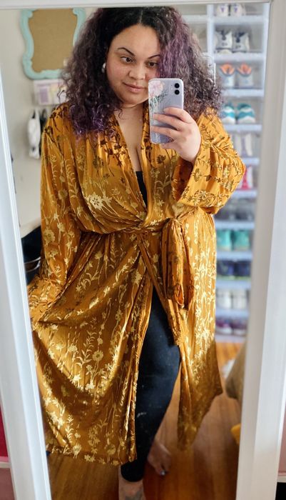Mytour shopping editor rocking the duster in orange.