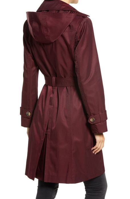 The back view of the burgundy trench coat.