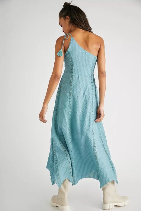 Back view of the dress in a striking blue hue.