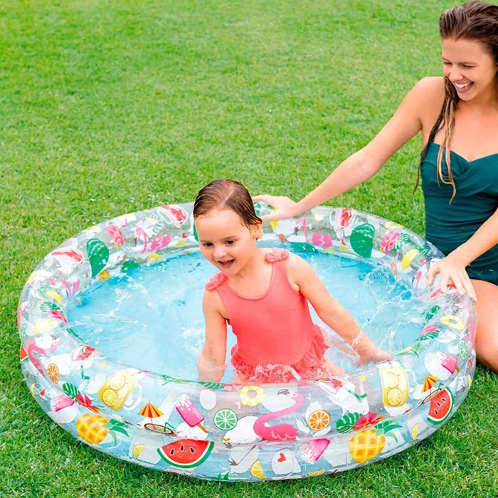 Parent and toddler having fun in the pool