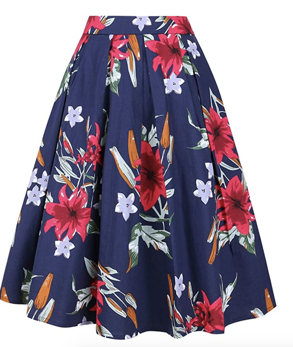 A pleated navy midi skirt adorned with vibrant red and soft blue flowers.