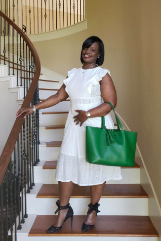 Reviewer wearing the white dress