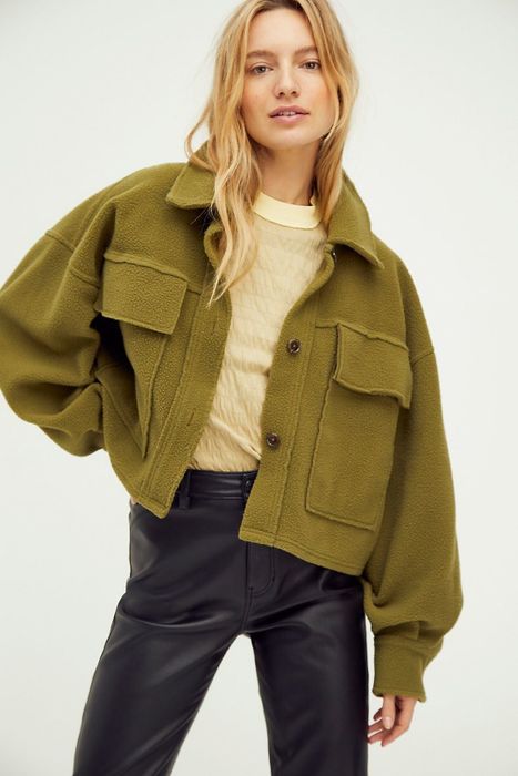 Model donning the olive-colored jacket.