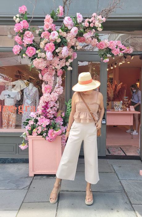 A reviewer photo showcasing the cream-colored capris