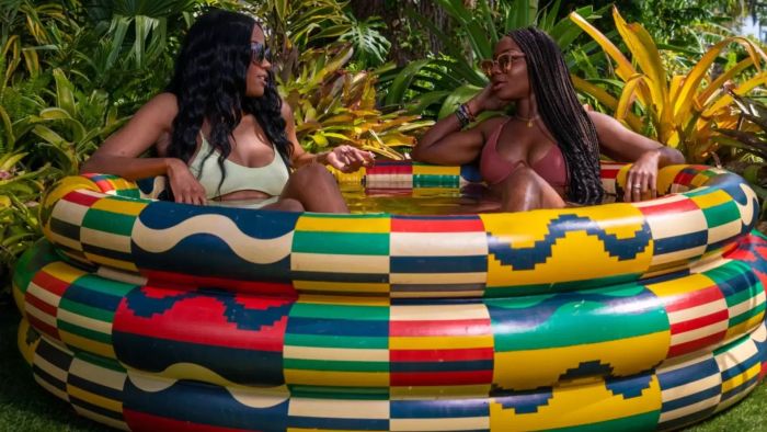 Models having fun in the inflatable pool