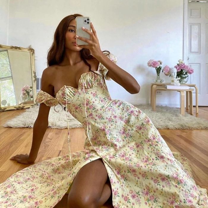 Model sporting a beige dress