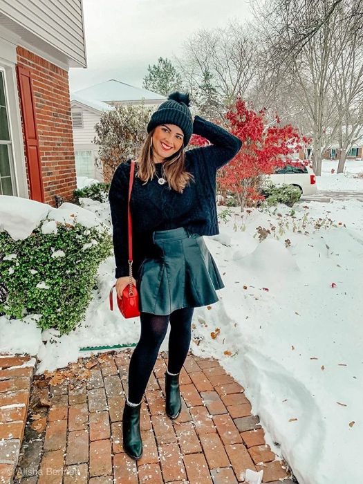 A reviewer is wearing a black skirt.