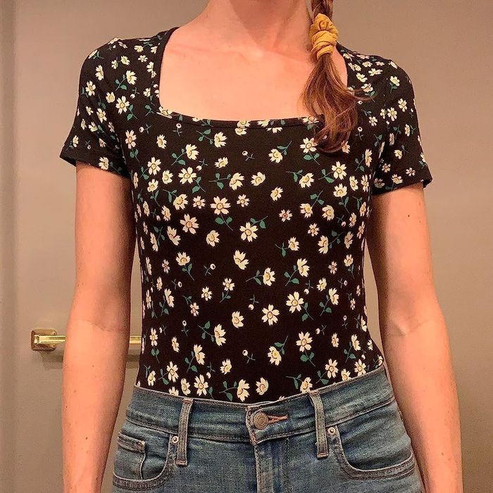 Image of reviewer wearing a daisy bodysuit