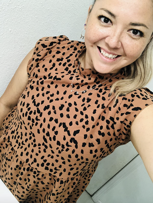 A customer photo review of them wearing the top in brown