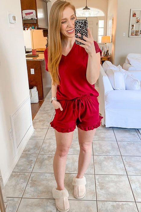 A different reviewer sporting the red set with one hand casually tucked in the pocket.