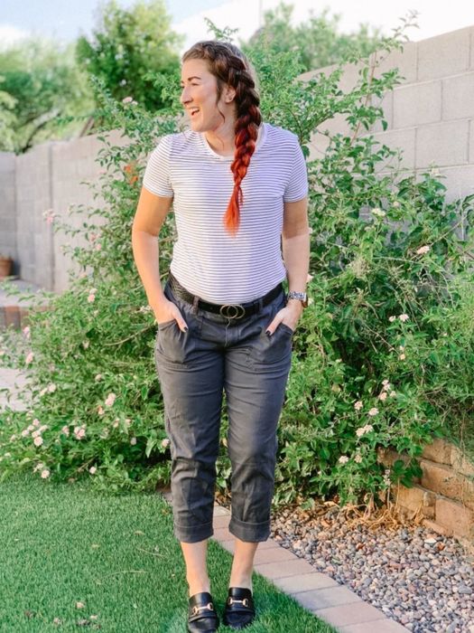 Reviewer wearing a striped crew neck tee