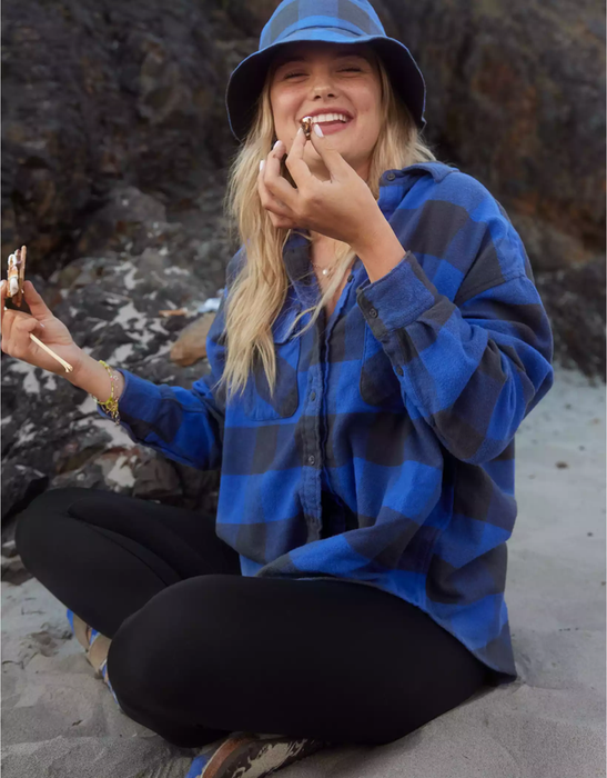 A model wearing a blue checkered flannel.