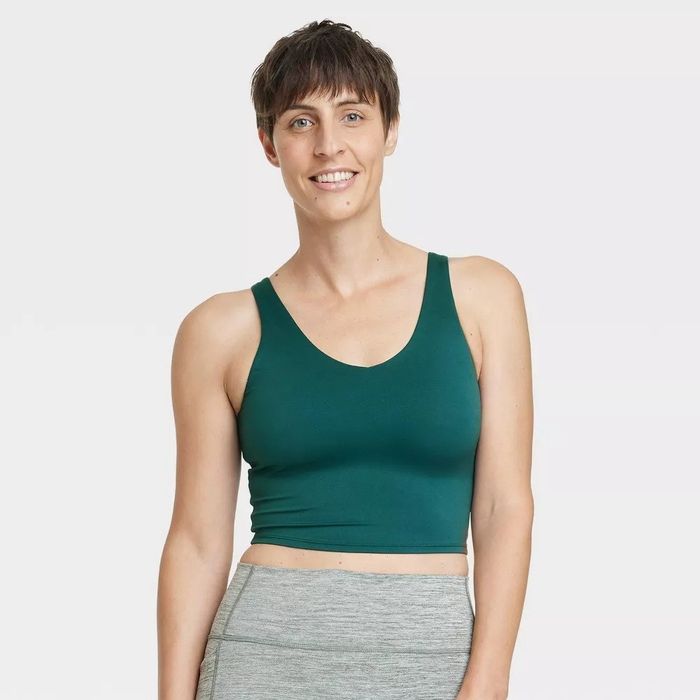 A model wearing the top in forest green