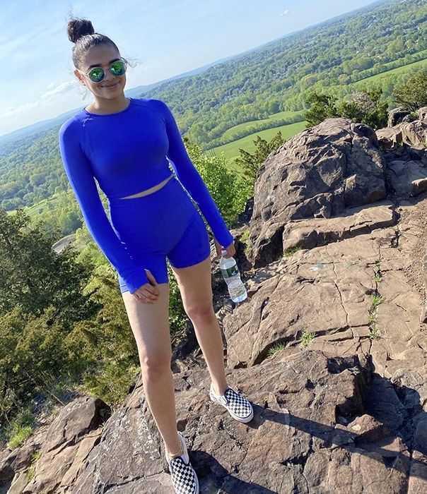 A reviewer wearing the blue long-sleeve set while hiking
