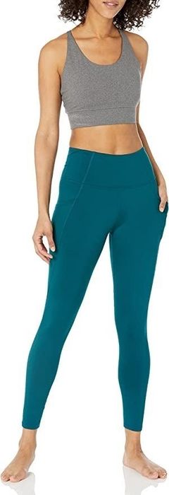 A model showing off the teal leggings