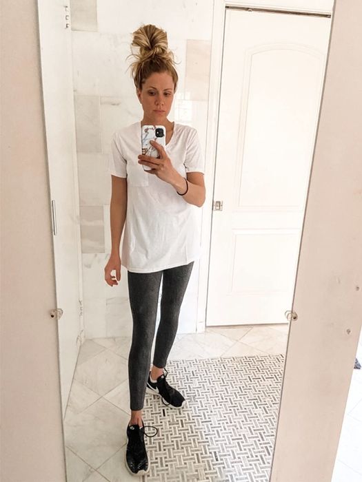A mirror selfie of a reviewer wearing the pocket T-shirt.