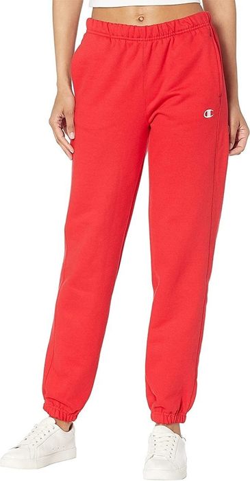 A model rocking the sweatpants in a bold, bright red