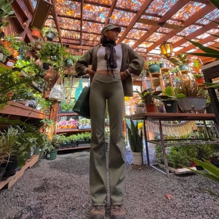 An Amazon reviewer showing off a pair of bootcut leggings.