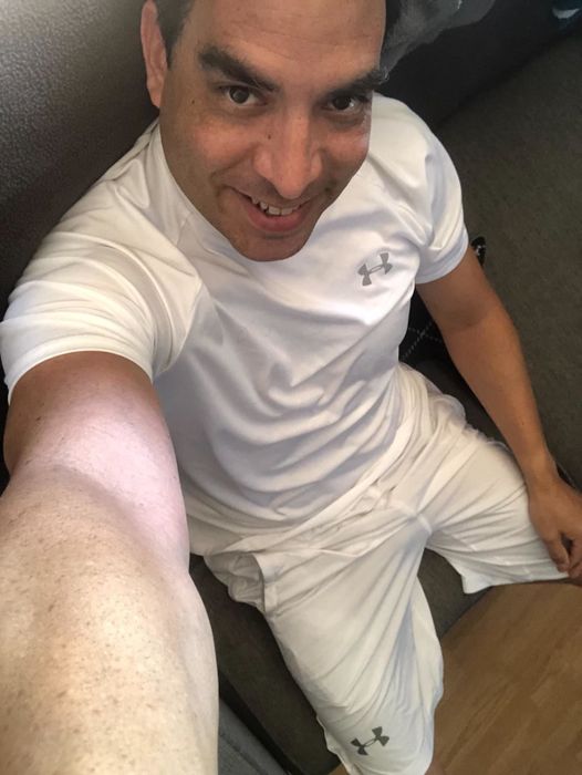 overhead selfie of the reviewer wearing a white Champion shirt
