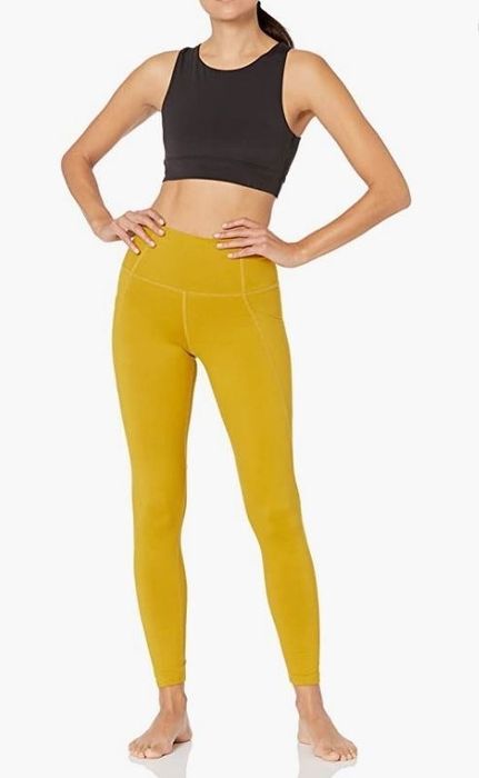 A model wearing yellow leggings