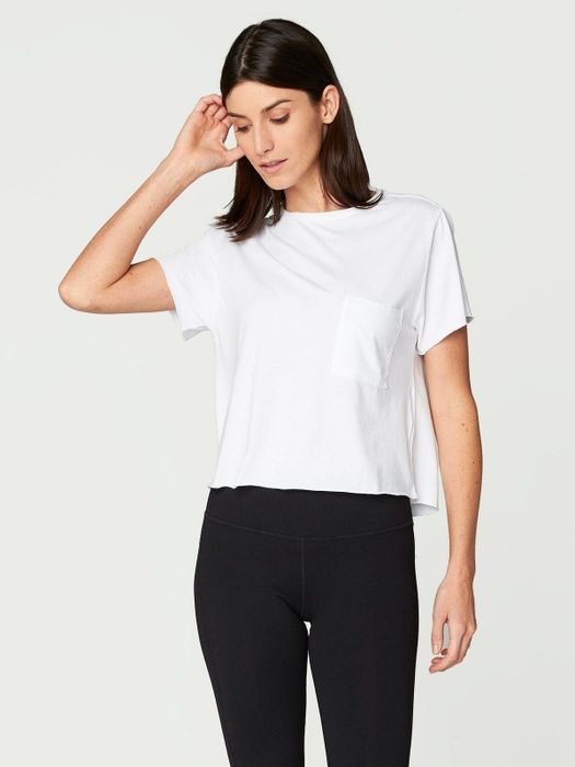 model wearing a white t-shirt with black jeans