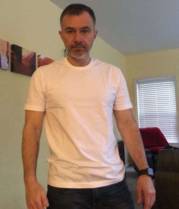 photo of the reviewer showcasing the white tee