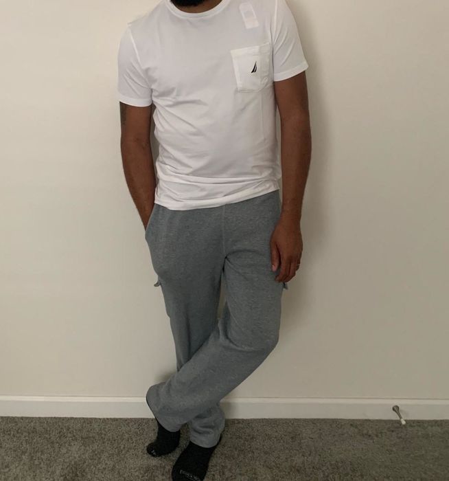 reviewer photo modeling the white tee while standing against a plain white wall