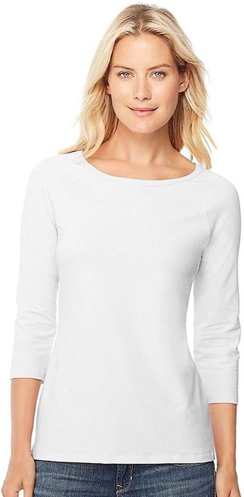A model showcasing the white long-sleeve shirt.