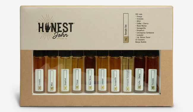 a collection of small dropper bottles containing cocktail bitters