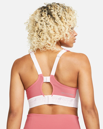 A back view of the same two-tone pink and white Nike sports bra.