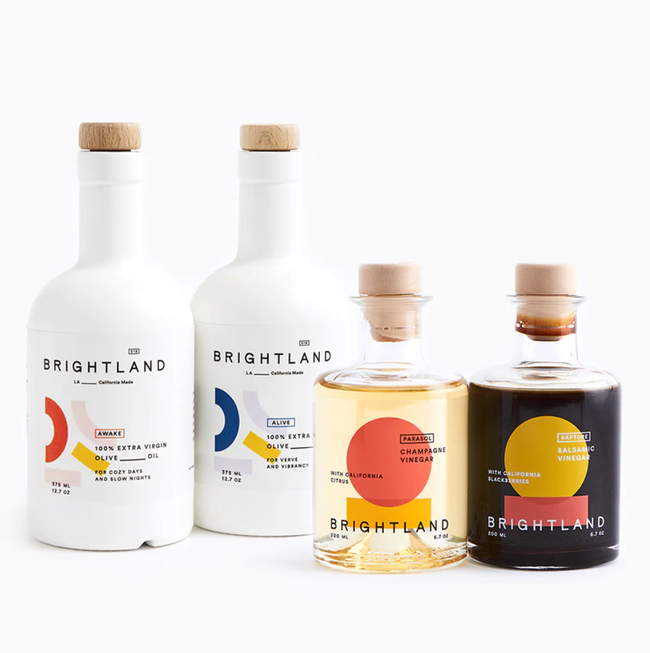 two bottles of olive oil and two bottles of vinegar