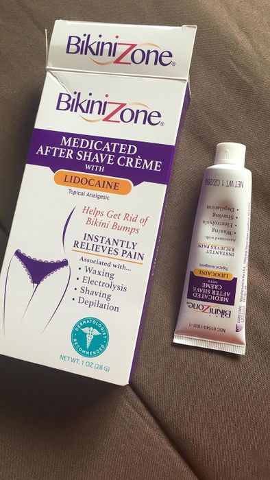 A reviewer’s photo of Bikini Zone cream and its packaging, highlighting its ability to soothe shaving irritation.