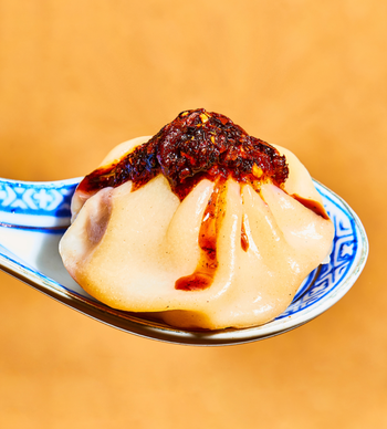 the sauce drizzled over a dumpling