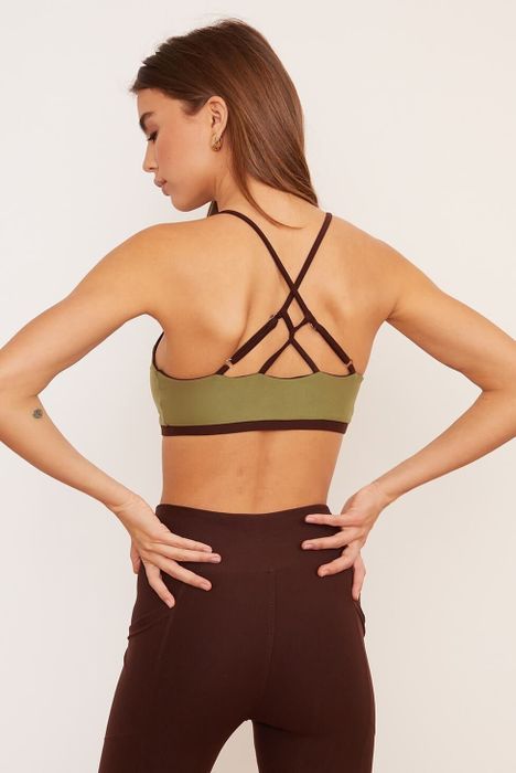 A back view of the crisscross bra with the green side showing and chai-colored straps.
