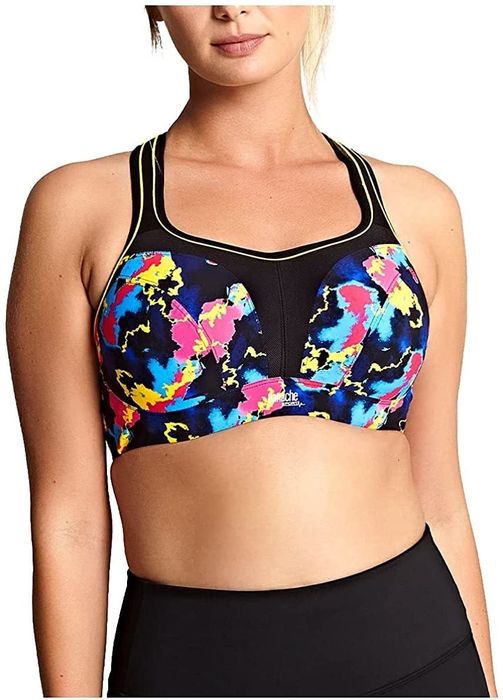 The model is wearing an underwire sports bra featuring a vibrant blue, yellow, and pink print.