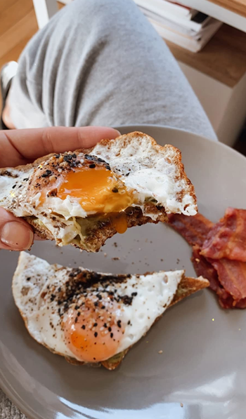 Image of sunny-side up eggs garnished with truffle seasoning
